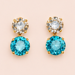 Pack Iris de anillo y pendientes con baño de oro, piedras azul agua y champagne